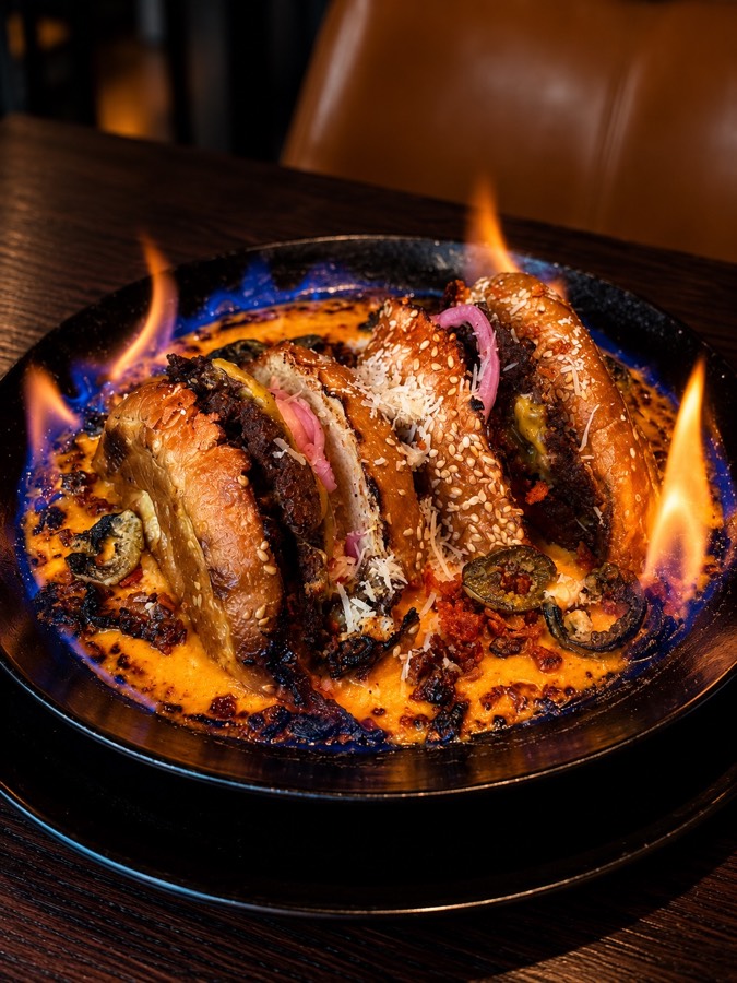 A flaming Take a Bath dish