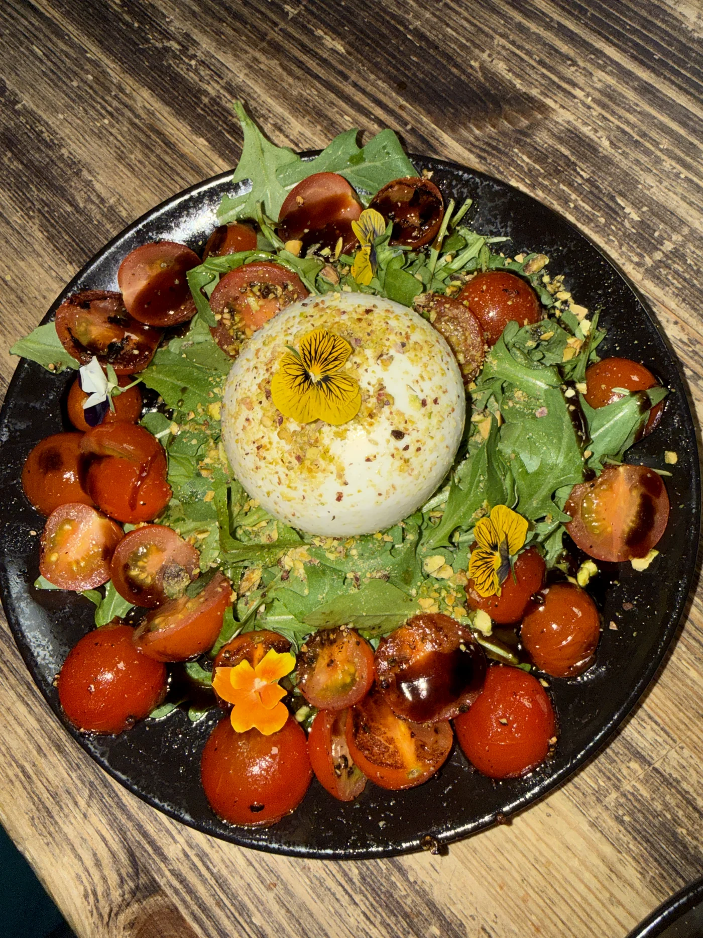 CLIFF's burrata with cherry tomatoes, greens and flowers